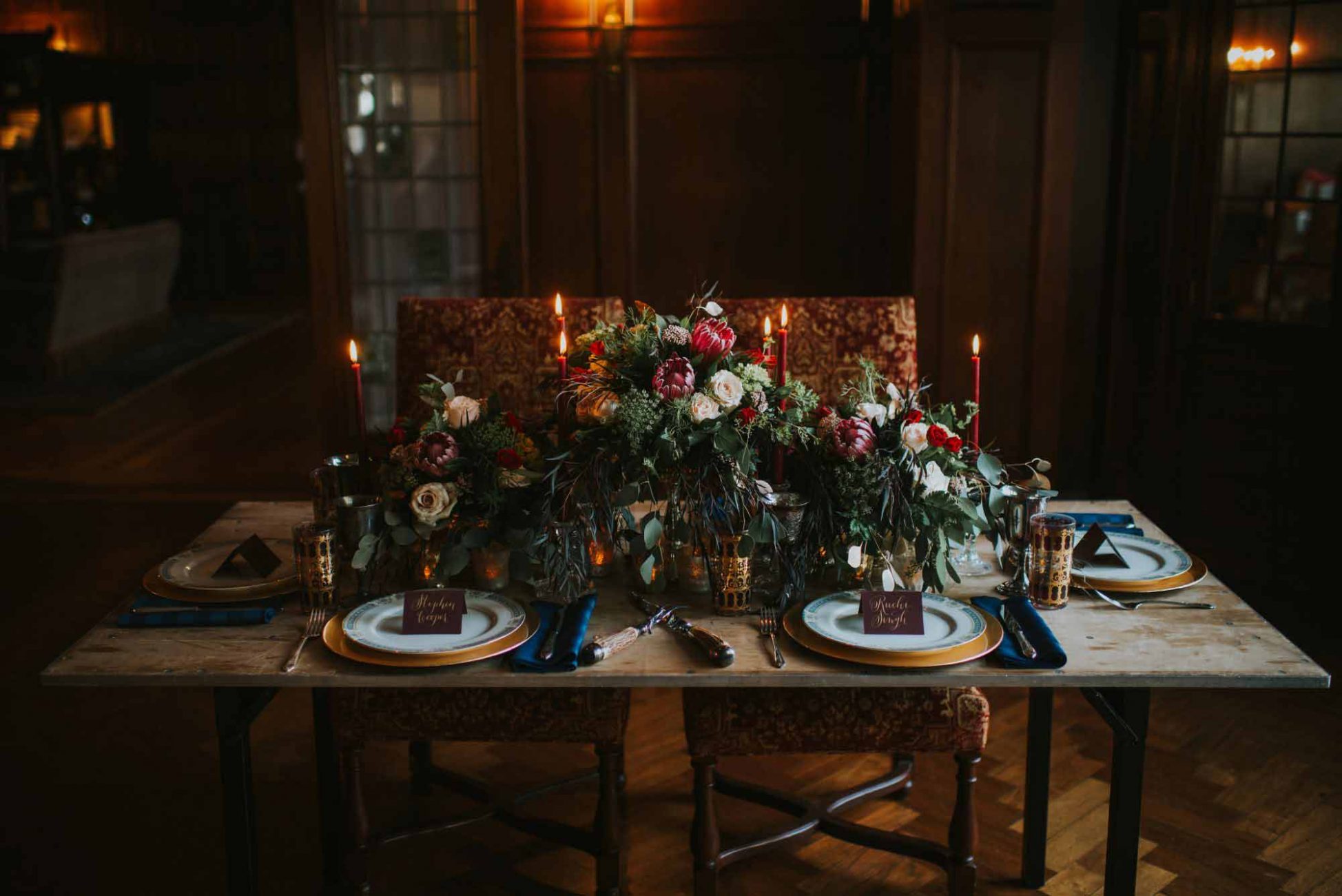 Dark and romantic place setting at a wedding